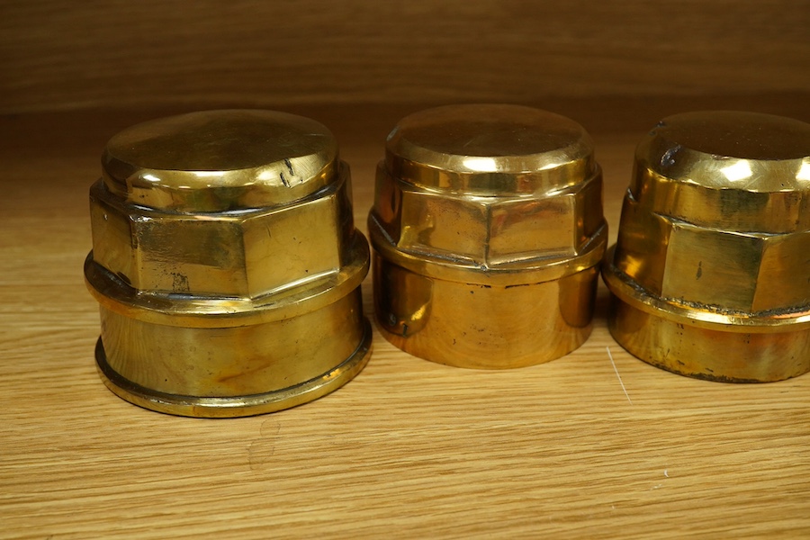 Six substantial Victorian brass wagon axle hubs, all threaded internally, together with two Daimler emblems, both with two integral threaded bolts to the reverse (8). Condition - good.